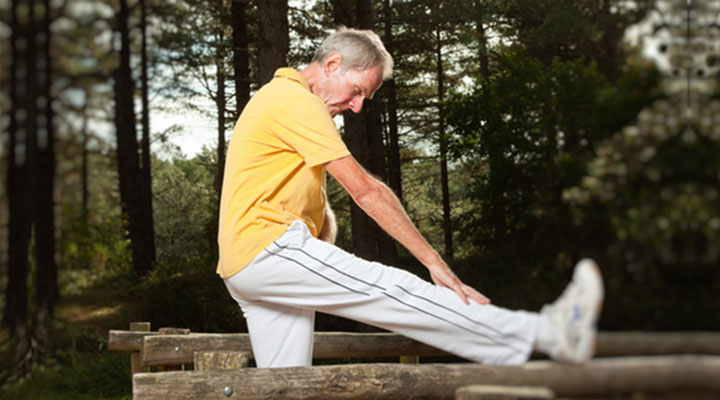 Man over 50 years old, exercising outdoors