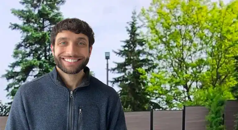 PJ, a motivated fitness trainer specializing in senior health, posing in a gym setting, ready to inspire and guide seniors in Etobicoke and Vaughan